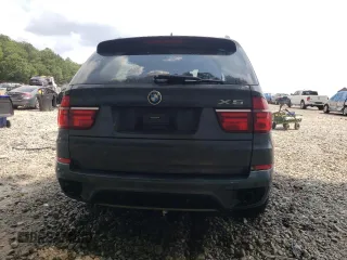 2012 BMW X5 35i z VIN 5UXZV4C55CL753810, wystawiony jako Copart lot #62405565 z przebiegiem 178 504 mil mil oraz Szkoda całkowita • Salvage title. Historia ofert i sprzedaży dostępna na DreamBid. Obrazek 6.