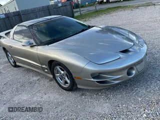 1999 Pontiac Firebird Formula z VIN 2G2FV22G1X2205745, wystawiony jako Copart lot #65841425 z przebiegiem 142 913 mil mil oraz Czysty tytuł • Clean title. Historia ofert i sprzedaży dostępna na DreamBid. Obrazek 1.
