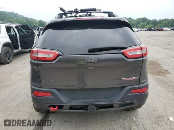 2014 Jeep Cherokee Trailhawk z VIN 1C4PJMBS9EW159721, wystawiony jako Copart lot #60719525 z przebiegiem 136 807 mil mil oraz Szkoda całkowita • Salvage title. Historia ofert i sprzedaży dostępna na DreamBid. Obrazek 6.