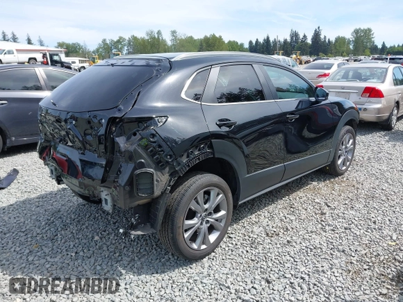 2023 Mazda CX-30 S Carbon Edition with VIN 3MVDMBCM3PM562447, listed as a IAAI auction lot 42174280 with 22,028 mi miles and . Bid and sale history available at DreamBid. Image 4.