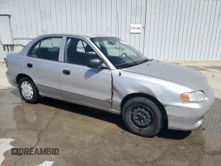 1998 Hyundai Accent z VIN KMHVF24N8WU500040, wystawiony jako Copart lot #52039755 z przebiegiem 103 631 mil mil oraz Szkody całkowita. Historia ofert i sprzedaży dostępna na DreamBid. Obrazek 4.