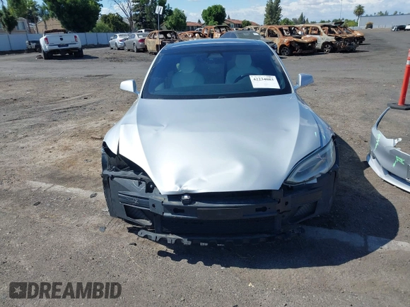 2016 Tesla Model S 90D with VIN 5YJSA1E22GF174637, listed as a IAAI auction lot 42234083 with 142,915 mi miles and . Bid and sale history available at DreamBid. Image 13.