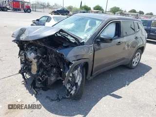 2023 Jeep Compass Sport with VIN 3C4NJDANXPT571285, listed as a IAAI auction lot 42314882 with 17,957 mi miles and . Bid and sale history available at DreamBid. Image 2.