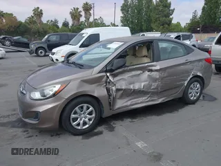 2014 Hyundai Accent GLS z VIN KMHCT4AE4EU758926, wystawiony jako IAAI lot #42451816 z przebiegiem 80 387 mil mil oraz . Historia ofert i sprzedaży dostępna na DreamBid. Obrazek 2.