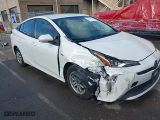 2019 Toyota Prius L Eco with VIN JTDKARFU7K3093038, listed as a IAAI auction lot 41768066 with 124,495 mi miles. Bid and sale history available at carsss.com. Image 1.