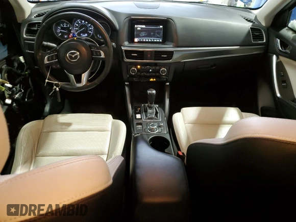 2016 Mazda CX-5 Grand Touring with VIN JM3KE4DY9G0708024, listed as a Copart auction lot 44689995 with 113,002 mi miles and Salvage Title. Bid and sale history available at DreamBid. Image 8.