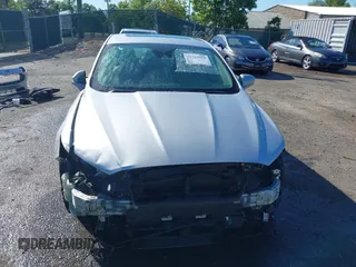 2019 Ford Fusion Titanium with VIN 3FA6P0RUXKR141565, listed as a IAAI auction lot 42323999 with 206,397 mi miles and . Bid and sale history available at DreamBid. Image 6.