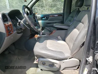 2004 GMC Envoy SLT with VIN 1GKDT13S042281050, listed as a Copart auction lot 60024304 with 267,205 mi miles and Salvage Title. Bid and sale history available at carsss.com. Image 7.