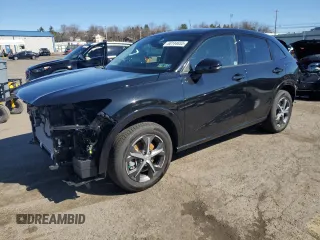 2025 Honda HR-V EX-L z VIN 3CZRZ2H77SM751875, wystawiony jako Copart lot #50144655 z przebiegiem 916 mil mil oraz Szkoda całkowita • Salvage title. Historia ofert i sprzedaży dostępna na DreamBid. Obrazek 1.