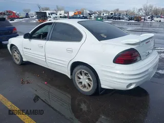 1999 Pontiac Grand Am SE1 with VIN 1G2NE52E3XM837376, listed as a IAAI auction lot 41552372 with 1 mi miles. Bid and sale history available at carsss.com. Image 3.