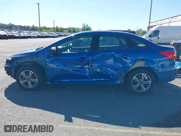 2018 Ford Focus SE z VIN 1FADP3FE4JL279265, wystawiony jako IAAI lot #42068130 z przebiegiem 43 616 mil mil oraz . Historia ofert i sprzedaży dostępna na DreamBid. Obrazek 15.