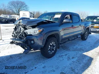 2017 Toyota Tacoma SR5 with VIN 3TMDZ5BN1HM021199, listed as a IAAI auction lot 41387400 with 93,392 mi miles. Bid and sale history available at carsss.com. Image 2.