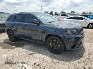 2018 Jeep Grand Cherokee Trackhawk with VIN 1C4RJFN99JC309254, listed as a Copart auction lot 64061615 with 104,558 mi miles and Clean title. Bid and sale history available at DreamBid. Image 4.