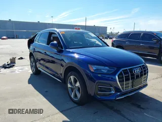 2023 Audi Q5 Premium Plus z VIN WA1BBAFYXP2195975, wystawiony jako IAAI lot #41309879 z przebiegiem 11 124 mil mil oraz . Historia ofert i sprzedaży dostępna na DreamBid. Obrazek 1.