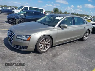 2012 Audi A8 z VIN WAURVAFD0CN001646, wystawiony jako IAAI lot #41524110 z przebiegiem 105 187 mil mil oraz . Historia ofert i sprzedaży dostępna na DreamBid. Obrazek 2.