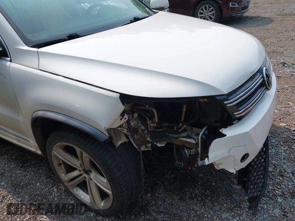 2014 Volkswagen Tiguan SEL with VIN WVGAV3AX7EW022239, listed as a IAAI auction lot 42381670 with 180,729 mi miles and . Bid and sale history available at DreamBid. Image 6.