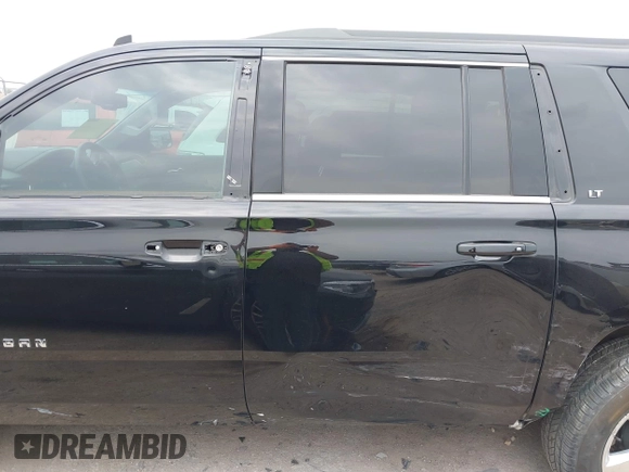 2015 Chevrolet Suburban LT with VIN 1GNSCJKC1FR304656, listed as a IAAI auction lot 42071124 with 133,140 mi miles. Bid and sale history available at carsss.com. Image 14.
