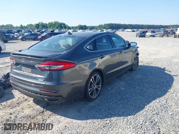 2020 Ford Fusion Titanium with VIN 3FA6P0K91LR175109, listed as a IAAI auction lot 42267532 with 75,000 mi miles and . Bid and sale history available at DreamBid. Image 4.