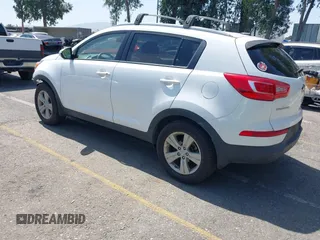 2013 Kia Sportage LX with VIN KNDPB3A23D7514304, listed as a IAAI auction lot 42544397 with 82,456 mi miles and . Bid and sale history available at DreamBid. Image 3.