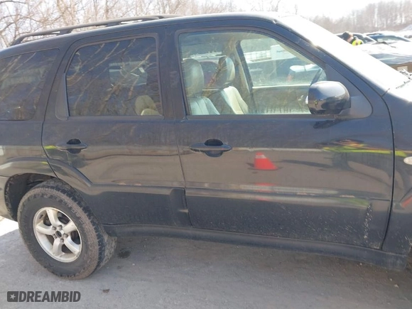 2005 Mazda Tribute s with VIN 4F2YZ06165KM39949, listed as a IAAI auction lot 41796476 with 270,492 mi miles. Bid and sale history available at carsss.com. Image 13.
