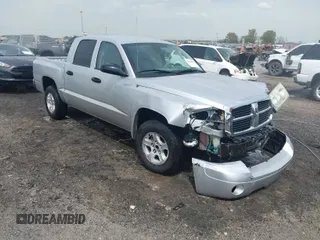 2007 Dodge Dakota SLT with VIN 1D7HE48KX7S122712, listed as a IAAI auction lot 41888864 with 114,384 mi miles and . Bid and sale history available at carsss.com. Image 1.