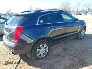 2015 Cadillac SRX with VIN 3GYFNAE35FS608595, listed as a IAAI auction lot 41282751 with 127,055 mi miles and . Bid and sale history available at DreamBid. Image 4.