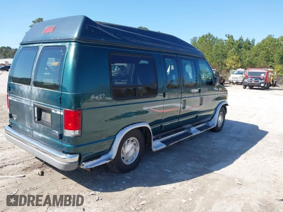 1999 Ford Econoline Cargo with VIN 1FDRE14W2XHB18989, listed as a IAAI auction lot 41740961 with 152,028 mi miles. Bid and sale history available at carsss.com. Image 4.