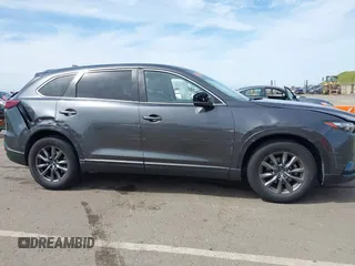 2021 Mazda CX-9 Sport with VIN JM3TCBBY7M0520437, listed as a IAAI auction lot 42022562 with 77,063 mi miles and . Bid and sale history available at DreamBid. Image 6.