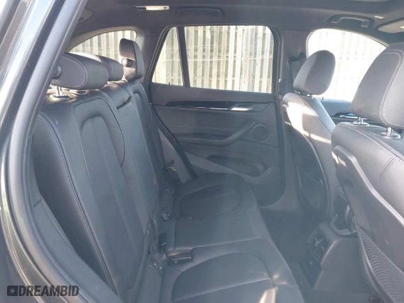 2018 BMW X1 xDrive28i with VIN WBXHT3C33J5F90349, listed as a IAAI auction lot 41385063 with 55,994 mi miles. Bid and sale history available at carsss.com. Image 8.