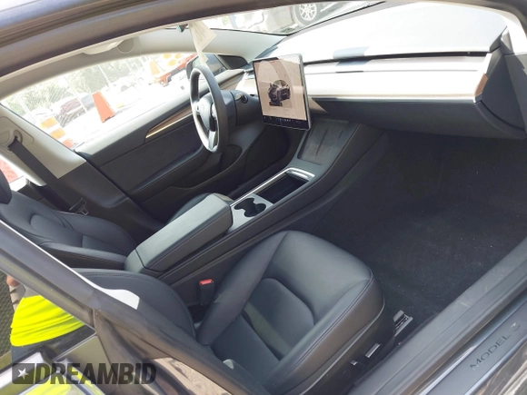 2023 Tesla Model 3 with VIN 5YJ3E1EA2PF566047, listed as a IAAI auction lot 42481008 with 21,143 mi miles and . Bid and sale history available at DreamBid. Image 5.