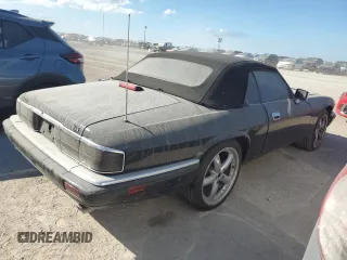 1995 Jaguar XJS with VIN SAJNX2748SC198836, listed as a Copart auction lot 75833334 with 145,794 mi miles and Salvage Title. Bid and sale history available at carsss.com. Image 3.