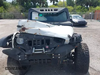 2016 Jeep Wrangler Unlimited Sport with VIN 1C4BJWDGXGL335825, listed as a IAAI auction lot 28960589 with 28,515 mi miles and . Bid and sale history available at DreamBid. Image 13.