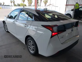 2021 Toyota Prius L Eco z VIN JTDKAMFU5M3146342, wystawiony jako IAAI lot #42249219 z przebiegiem 49 810 mil mil oraz . Historia ofert i sprzedaży dostępna na DreamBid. Obrazek 3.