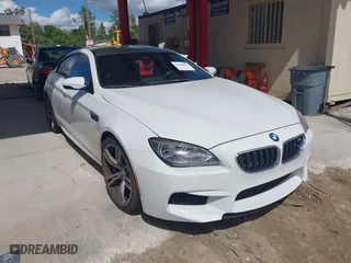 2014 BMW M6 with VIN WBS6C9C50EDV73809, listed as a IAAI auction lot 41648991 with 68,054 mi miles. Bid and sale history available at carsss.com. Image 1.