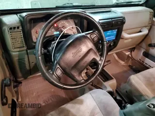 2003 Jeep Wrangler Rubicon z VIN 1J4FA69S13P345591, wystawiony jako Copart lot #41741685 z przebiegiem 85 335 mil mil oraz Szkoda całkowita • Salvage title. Historia ofert i sprzedaży dostępna na DreamBid. Obrazek 8.