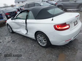 2016 BMW 2 Series 228i xDrive with VIN WBA1L9C59GV767802, listed as a IAAI auction lot 41132997 with 87,674 mi miles. Bid and sale history available at carsss.com. Image 3.