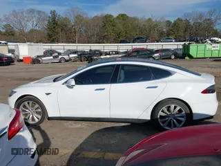2014 Tesla Model S 60 with VIN 5YJSA1H13EFP62451, listed as a IAAI auction lot 41639068 with 88,000 mi miles and . Bid and sale history available at DreamBid. Image 14.