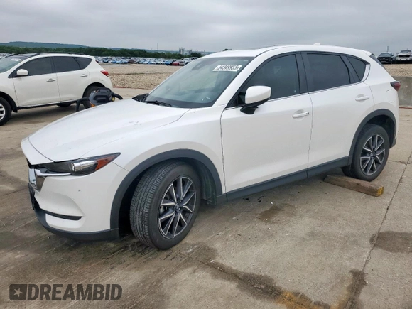 2018 Mazda CX-5 Touring z VIN JM3KFACM0J0469433, wystawiony jako Copart lot #54349955 z przebiegiem Nie podano mil oraz Szkoda całkowita • Salvage title. Historia ofert i sprzedaży dostępna na DreamBid. Obrazek 1.