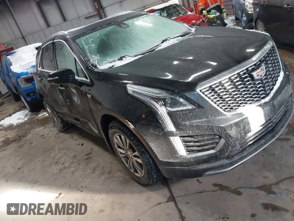 2021 Cadillac XT5 FWD Premium Luxury with VIN 1GYKNCRS3MZ198651, listed as a IAAI auction lot 41607734 with 49,275 mi miles. Bid and sale history available at carsss.com. Image 1.