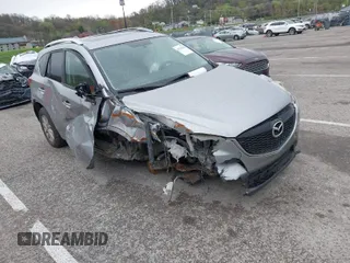 2014 Mazda CX-5 Touring with VIN JM3KE4CY1E0426409, listed as a IAAI auction lot 41924258 with 116,956 mi miles. Bid and sale history available at carsss.com. Image 1.