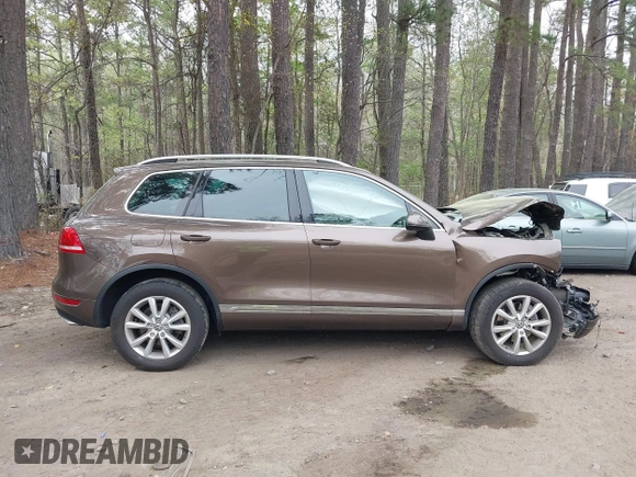 2014 Volkswagen Touareg Sport with VIN WVGEF9BP2ED007904, listed as a IAAI auction lot 41960811 with 126,230 mi miles and . Bid and sale history available at DreamBid. Image 13.