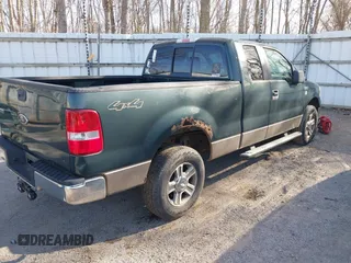 2005 Ford F-150 XLT with VIN 1FTPX14505FB72622, listed as a IAAI auction lot 41823532 with 165,918 mi miles. Bid and sale history available at carsss.com. Image 4.
