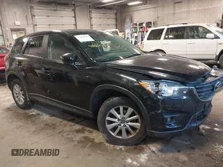 2016 Mazda CX-5 Touring z VIN JM3KE4CY3G0912822, wystawiony jako IAAI lot #41411733 z przebiegiem 124 789 mil mil oraz . Historia ofert i sprzedaży dostępna na DreamBid. Obrazek 1.