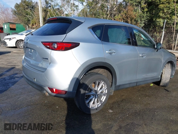 2020 Mazda CX-5 Grand Touring z VIN JM3KFADM0L0738337, wystawiony jako IAAI lot #41485078 z przebiegiem Nie podano mil oraz . Historia ofert i sprzedaży dostępna na DreamBid. Obrazek 15.