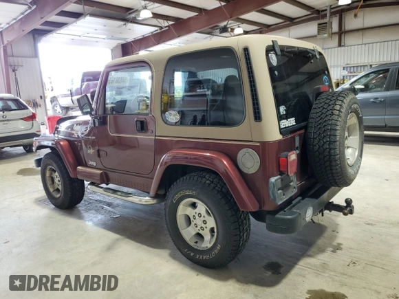 2002 Jeep Wrangler Sahara с VIN 1J4FA59S62P751858, выставлен на аукционе Copart как лот 56638165 с пробегом 270 770 миль миль и Списание • Salvage title. История ставок и продаж доступна на DreamBid. Изображение 2.