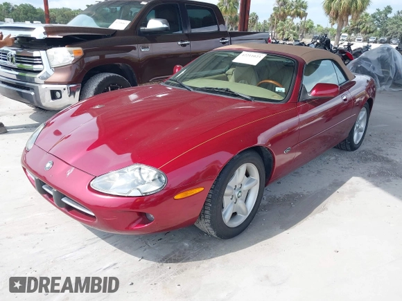 1997 Jaguar XK with VIN SAJGX274XVC004952, listed as a IAAI auction lot 42211023 with 109,889 mi miles and . Bid and sale history available at DreamBid. Image 2.