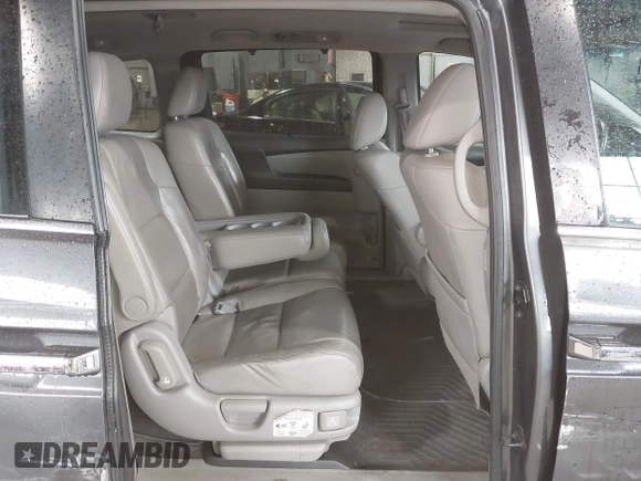 2012 Honda Odyssey EX-L with VIN 5FNRL5H63CB137198, listed as a IAAI auction lot 42706690 with 305,753 mi miles and . Bid and sale history available at DreamBid. Image 8.