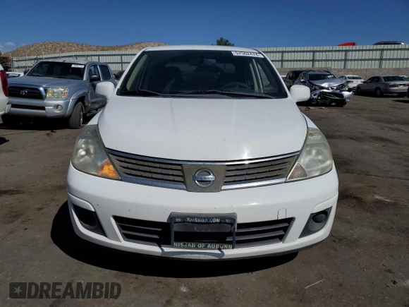 2009 Nissan Versa 1.8 S with VIN 3N1BC11E49L371066, listed as a Copart auction lot 57502474 with 157,127 mi miles and Salvage Title. Bid and sale history available at carsss.com. Image 5.