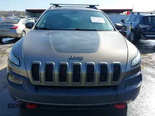 2017 Jeep Cherokee Trailhawk L Plus with VIN 1C4PJMBB6HW654172, listed as a IAAI auction lot 41851236 with 104,263 mi miles. Bid and sale history available at carsss.com. Image 12.