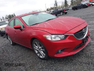 2014 Mazda Mazda6 i Touring with VIN JM1GJ1T66E1122252, listed as a IAAI auction lot 41877355 with 125,305 mi miles. Bid and sale history available at carsss.com. Image 1.